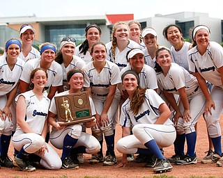 The Poland softball team smiles for a group photo after beating Crestwood to win the Division II regional finals at Firestone Stadium in Akron on Saturday. EMILY MATTHEWS | THE VINDICATOR