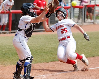 Poland's Camryn Lattanzio catches the ball to get Crestwood's Maci Head out at home during their Division II regional final game at Firestone Stadium in Akron on Saturday. EMILY MATTHEWS | THE VINDICATOR