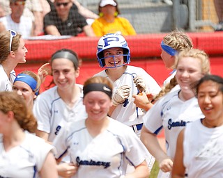 Poland's Ashley Wire celebrates with her team after hitting a home run during their Division II regional final game against Crestwood at Firestone Stadium in Akron on Saturday. EMILY MATTHEWS | THE VINDICATOR