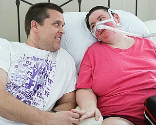 Christine Terlesky, who has ALS, shares a moment with her husband, Brian.