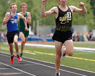 AUSTINTOWN, OHIO - May 25, 2019: Track & Field  D2 Region at Austintown-Fitch High School. .Boys 1600m. Garfield's Tyler Klouda crosses the line in 1st, Photo by MICHAEL G. TAYLOR | THE VINDICATOR