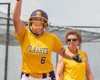 DIANNA OATRIDGE | THE VINDICATOR  Champion's Allison Smith (6) gestures in celebration after hitting a solo home run as Coach Cheryl Weaver looks on during the Division III Regional Final against Northwestern on Saturday in Massillon.