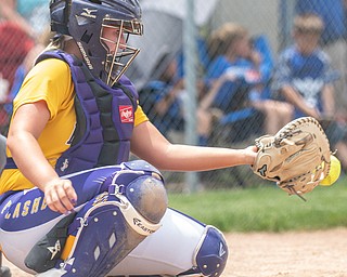 DIANNA OATRIDGE | THE VINDICATOR  Champion catcher Gabby Hollenbaugh concentrates on making a catch during their Division III Regional Final game versus Northwestern on Saturday in Massillon. Champion won 3-0.