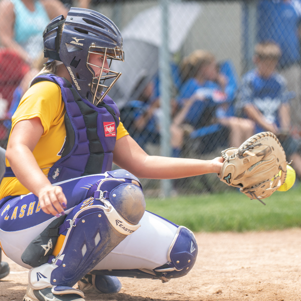 DIANNA OATRIDGE | THE VINDICATOR  Champion catcher Gabby Hollenbaugh concentrates on making a catch during their Division III Regional Final game versus Northwestern on Saturday in Massillon. Champion won 3-0.