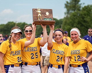 DIANNA OATRIDGE | THE VINDICATOR  Champion team captains Carli Swipas (22), Abby Grace (25), Skye Kennedy-Snodgrass (24), and Gabby Hollenbaugh (12) raise the Division III Regional Championship trophy after defeating Northwestern 3-0 on Saturday in Massillon.