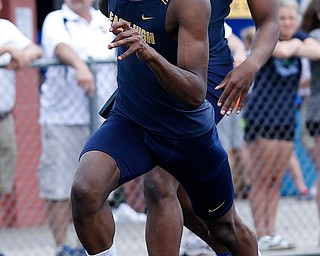 AUSTINTOWN, OHIO - May 24, 2019: Track & Field  D2 Region at Austintown-Fitch High School. .Boys 4x200m. Youngstown East's Ernest Hudson takes off after receving the batton from his teammate Giovanni Washington. East finished 3rd and to qualified for the state meet, Photo by MICHAEL G. TAYLOR | THE VINDICATOR