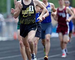 AUSTINTOWN, OHIO - May 25, 2019: Track & Field  D2 Region at Austintown-Fitch High School. .Boys 1600m. Garfield's Tyler Klouda leads the pack. Tyler Klouda finishes 1st, Photo by MICHAEL G. TAYLOR | THE VINDICATOR