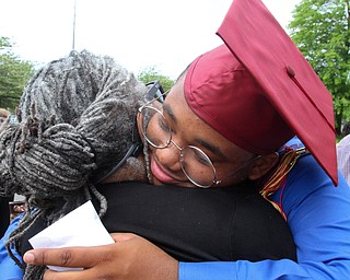 William D. Lewis the vindicator  Mooney grad Andre Carter gets a hug from his aunt Cynthia Carter after graduation 5-26 at Stambaugh.