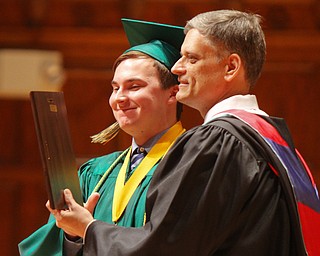 William D. Lewis the Vindicator Ursuline Valedictorian Alexander Stoneman is recognized by principal Matthew Sammartino during commencement 5-26 at Stambaugh.