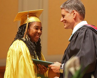 William D. Lewis the Vindicator Ursuline grad Dayshanette Harris is presented her diploma by principal Matthew Sammartino during commencement 5-26 at Stambaugh.