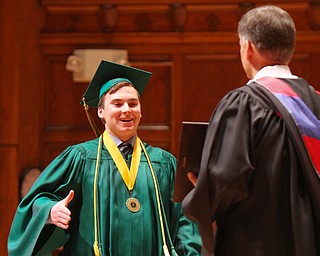 William D. Lewis the Vindicator Ursuline Valedictorian Alexander Stoneman is recognized by principal Matthew Sammartino during commencement 5-26 at Stambaugh.