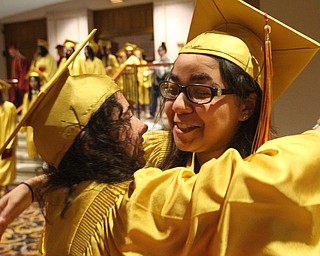 William D. Lewis the vindicator Mooney grads Amelia Mascarella, left,a nd Caitly Santiago hug after 5-26 coomencement at Stambaugh.