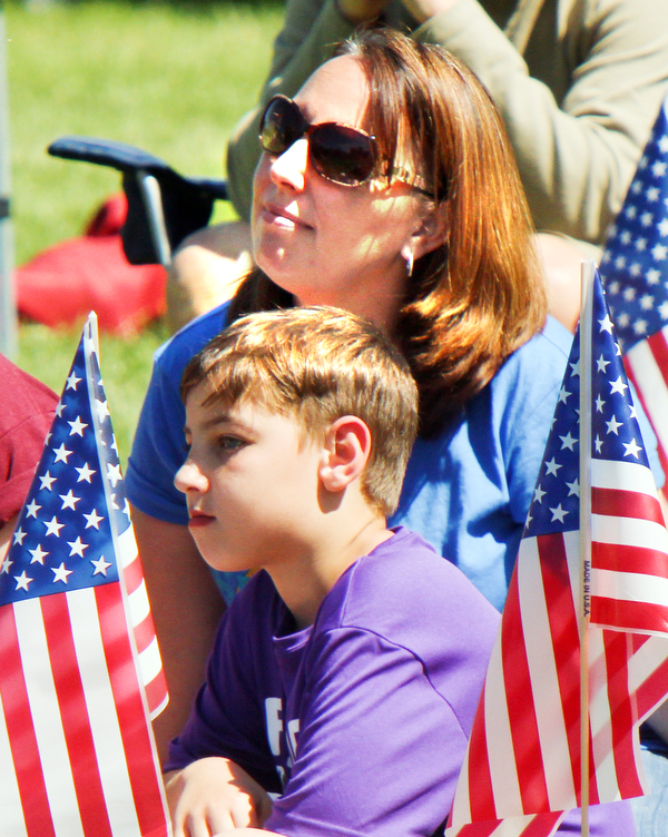 William D. Lewis The Vindicator Shannon Bray and her son Caden Brown, 10, were among a crowd of about 250 people who attended a Memorial Day ceremony in Boardman Park Monday.
