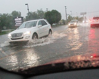 William D. Lewis The Vindicator   Heavy rains left RT224 in Boardman covered with water Tuesday night.