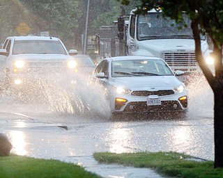 William D. Lewis The Vindicator   Heavy rains left RT224 in Poland covered with water Tuesday night.