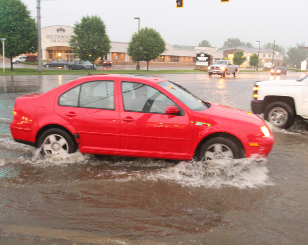 William D. Lewis The Vindicator   Heavy rains leftMarket St  in Boardman covered with water Tuesday night.