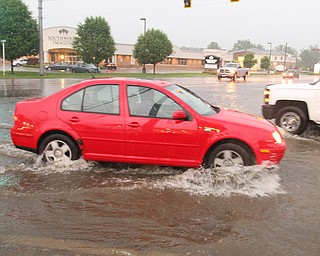 William D. Lewis The Vindicator   Heavy rains leftMarket St  in Boardman covered with water Tuesday night.