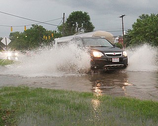 William D. Lewis The Vindicator   Heavy rains left Western Reserve Road in Boardman covered with water Tuesday night.