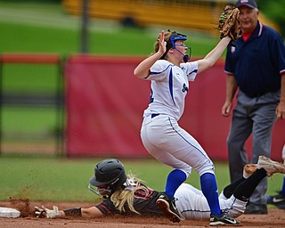 AKRON, OHIO - MAY 30, 2019: Poland's Lauren Sienkiewicz catches the ball while Jonathan Alder's Lindsey Potter steals second base in the second inning of their OHSAA Division II State-Semi Final game, Thursday morning at Firestone Stadium in Akron. Jonathan Alder won 6-3. DAVID DERMER | THE VINDICATOR