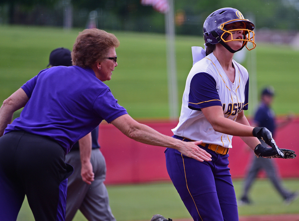 AKRON, OHIO - MAY 30, 2019: Champion's Emma Gumont, right, is congratulated by head coach Cheryl Weaver while running the bases after hitting a 2-run home run in the fourth inning of their OHSAA Division III State-Semi Final game, Thursday morning at Firestone Stadium in Akron. Champion won 10-0. DAVID DERMER | THE VINDICATOR