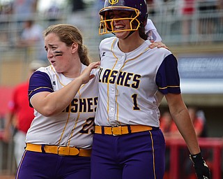 AKRON, OHIO - MAY 30, 2019: Champion's Emma Gumont, right, is congratulated by Abby White after hitting a 2-run home run in the fourth inning of their OHSAA Division III State-Semi Final game, Thursday morning at Firestone Stadium in Akron. Champion won 10-0. DAVID DERMER | THE VINDICATOR