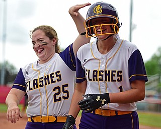 AKRON, OHIO - MAY 30, 2019: Champion's Emma Gumont, right, is congratulated by Abby White after hitting a 2-run home run in the fourth inning of their OHSAA Division III State-Semi Final game, Thursday morning at Firestone Stadium in Akron. Champion won 10-0. DAVID DERMER | THE VINDICATOR