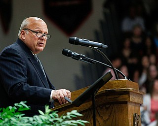 Canfield High School Principal Michael Moldovan gives welcoming remarks during the Canfield High School commencement ceremony in Canfield High School on Friday evening. EMILY MATTHEWS | THE VINDICATOR