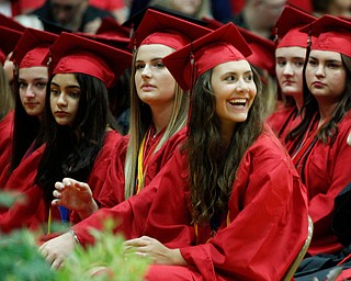 Canfield senior Aidyn Jones smiles up at her parents during the Canfield High School commencement ceremony in Canfield High School on Friday evening. EMILY MATTHEWS | THE VINDICATOR