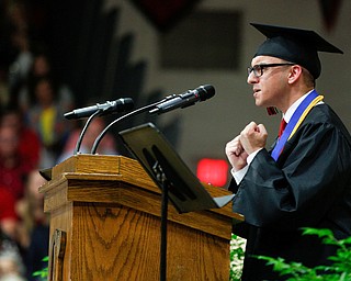 Canfield senior Dominic DeRamo gives the class address during the Canfield High School commencement ceremony in Canfield High School on Friday evening. EMILY MATTHEWS | THE VINDICATOR