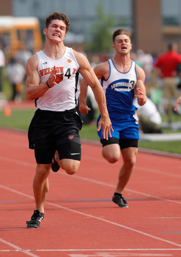 COLUMBUS, OHIO -June 1, 2019: OHSAA Track & Field Championships at Jesse Owens Stadium, Ohio State University. .D3 Boy's 100m. Wellsville's Justin Wright  leans for the finish line for the win. Photo by MICHAEL G. TAYLOR | THE VINDICATOR