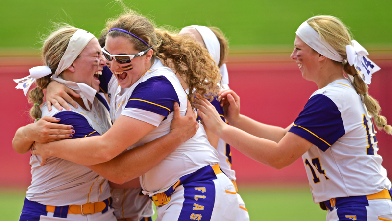 Champion starting pitcher Allison Smith is hugged by Abby White after defeating Cardington-Lincoln 5-0 to win the Division III State Softball Championship on Saturday morning at Firestone Stadium in Akron. 
