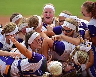AKRON, OHIO - JUNE 1, 2019: Members of the Champion softball team dog pile on the field in celebration after defeating Cardington-Lincoln 5-0 to win the Division III State Softball Championship, Saturday morning at Firestone Stadium. DAVID DERMER | THE VINDICATOR