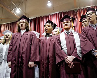 Boardman senior choir members sing their alma mater at the end of Boardman's commencement ceremony in the school's gym on Sunday afternoon. EMILY MATTHEWS | THE VINDICATOR