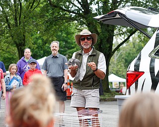 Jungle Terry Sullivan shows off Violet the chinchilla to the crowd at Riverfest on Sunday afternoon. EMILY MATTHEWS | THE VINDICATOR