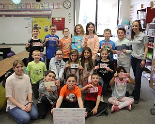 Neighbors | Abby Slanker.Hilltop Elementary School third-grade students in Marie Rupert’s class got a hands-on business lesson during the students’ economics project by starting thier own business. The students donated their profits to Project MKC and presented a check to Project MKC co-president Shelly Marlowe, left, on April 12.