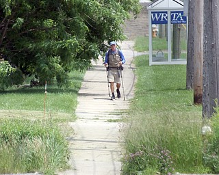  ROBERT K.YOSAY  | THE VINDICATOR...vetsdontforgetvets.com.William Shuttleworth is  on a 7-month walk across America from Massachusetts to California, ÒVets DonÕt Forget VetsÓ as he came through Youngstown on Tuesday...walking up St Rt 62
