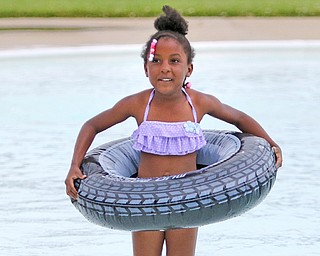 Euriana Fields, 5, enjoys playing with her inner tube in the Northside Pool on its opening day Wednesday. Pool hours are 1 to 8 p.m. Monday through Saturday.