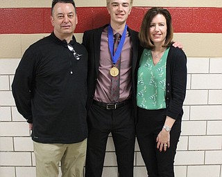 Neighbors | Abby Slanker.Canfield High School junior Brayden Beck was escorted by his parents, George and Caroline Beck, to the National Honor Society Induction Ceremony on April 17.