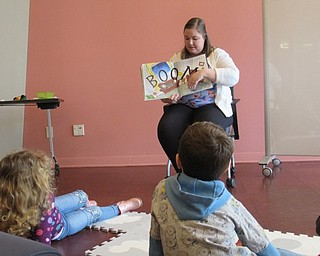 Neighbors | Jessica Harker.Children listened to Michael Kusalaba librarian Amelia Dale read "Boom Big Big Thunder and One Small Dog" at the library's Rainy Day event.