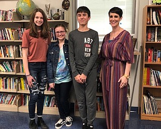 Neighbors | Submitted.Austintown Middle School students Kara Pirone, Aeryonnah Zura and Connor Smith were honored for their writing at the Youngstown Area Jewish Federation’s 26th Annual Community Holocaust Commemoration event, where Austintown Middle School teacher Michelle Best was a speaker, on May 2. Pictured are, from left, Pirone, Zura, Smith and Best.