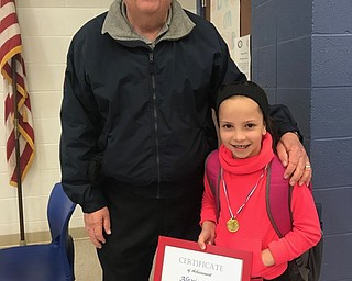 Neighbors | Submitted.Alexis Flood posed with a fireman after getting a ride to school on a firetruck May 13.