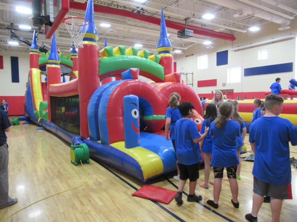 Neighbors | Jessica Harker.Fifth-graders waited to race through the bounce house at Austintown Intermediate School's Fun Day.