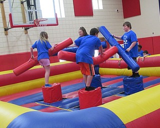 Neighbors | Jessica Harker.Austintown Bounce provided a number of cushioned games for fifth-graders at Austintown Intermediate School's annual Fun Day event.