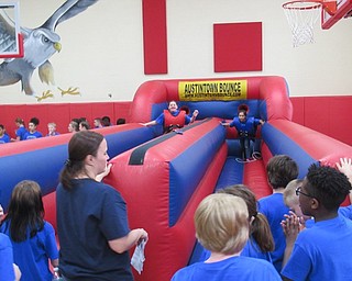 Neighbors | Jessica Harker.Fifth-graders battled to see who could place their velcro piece the furthest before being whipped back on May 30 at the annual Fun Day celebration.