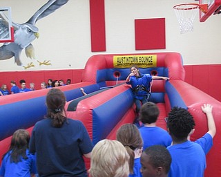 Neighbors | Jessica Harker.A number of bounce houses were present at Austintown Intermediate School's fifth-grade fun day on May 30 provided by Austintown Bounce.