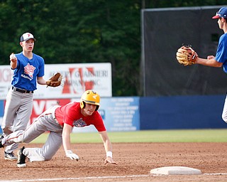 Mahoning County's Brett Porter, of Austintown Fitch, tries to throw the ball to Dan Windham, of Western Reserve, as Trumbull County's Preston Rapczak, of Newton Falls, dives back to first during the 2019 High School Valley All Star Classic at Eastwood Field on Friday evening. EMILY MATTHEWS | THE VINDICATOR