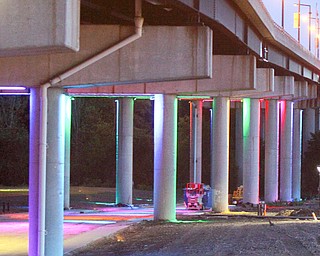 Youngstown officials and JAC Management and Huntington Bank representatives gathered for a ceremonial lighting of the Market Street Bridge Tuesday night to celebrate the Huntington Bank Community Alley.
