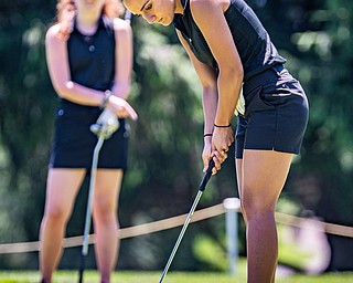 DIANNA OATRIDGE | THE VINDICATOR Carly Ungaro, 17, of Poland, sinks her putt during the Greatest Golfer of the Valley Junior Qualifier at Pine Lakes in Hubbard on Tuesday.