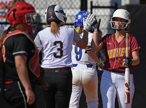 YOUNGSTOWN, OHIO - JUNE 11, 2019: Boardman's Jennifer Taraszewski, left, is congratulated by Mooney's Gia DiFabio after scoring on a a 2-RBI single by Mooney's Conchetta Ronaldi in the third inning of the 16th Annual Bill Sferra Softball Classic, Tuesday afternoon at Youngstown State University. DAVID DERMER | THE VINDICATOR