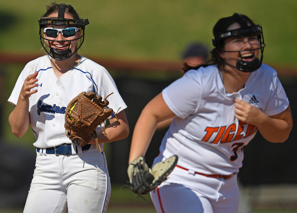 YOUNGSTOWN, OHIO - JUNE 11, 2019: Poland pitcher Ashley Wire, left, smiles after catching a comeback from Champion's Abby White in the fourth inning of the 16th Annual Bill Sferra Softball Classic, Tuesday afternoon at Youngstown State University. DAVID DERMER | THE VINDICATOR